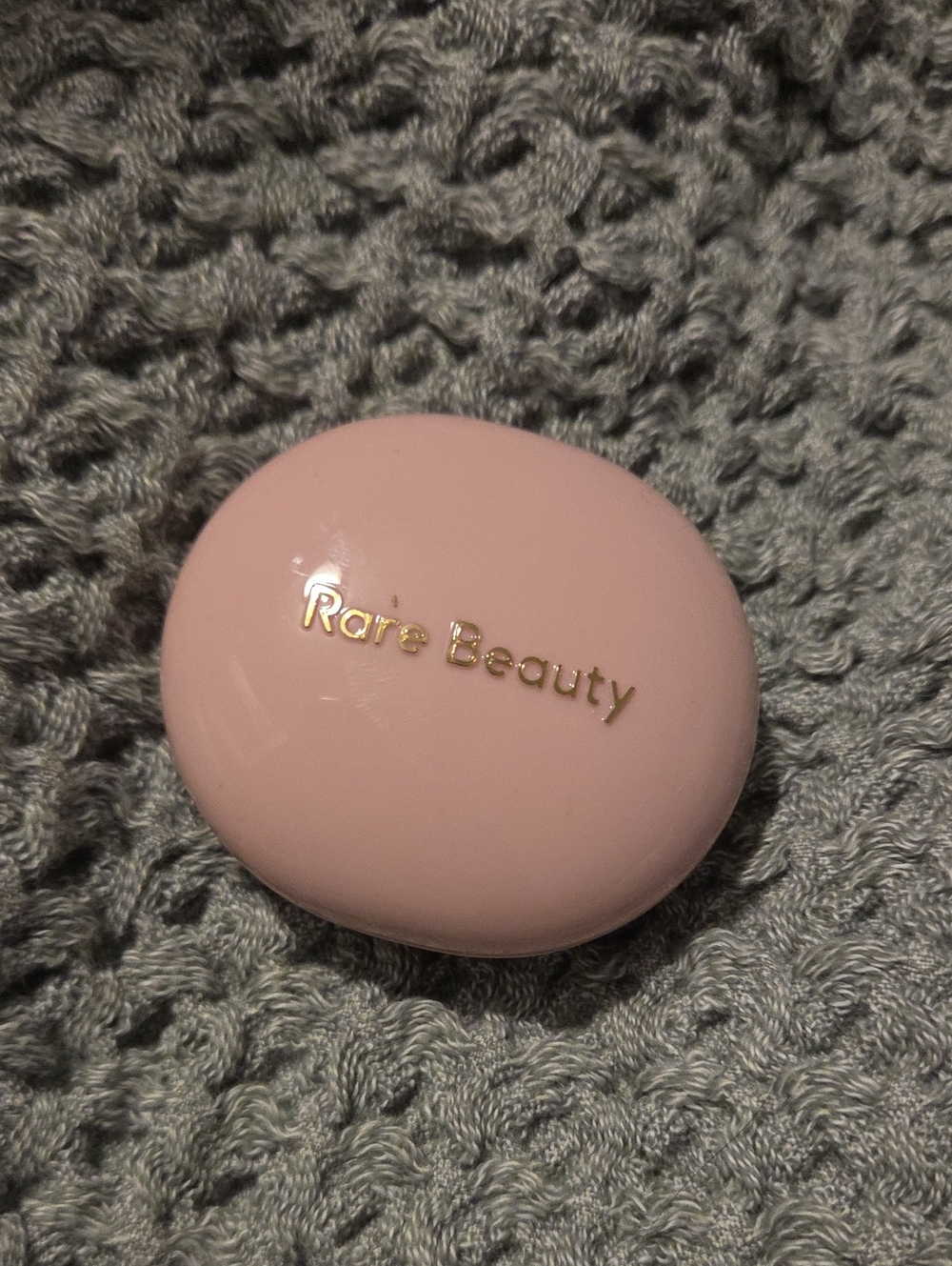 Rare Beauty soft pink compact blush case with gold logo